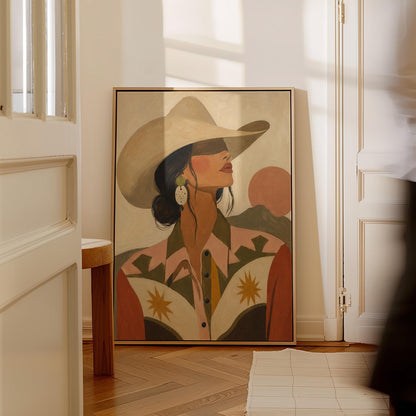 Cowgirl in profile in a cream hat and star-trimmed rodeo shirt by pink mountains, canvas wall art on a quiet wall in a considered interior