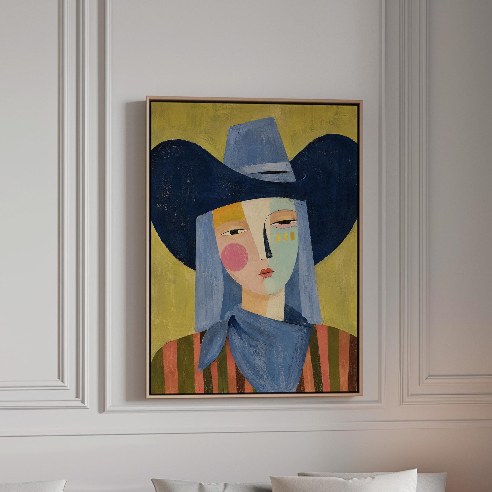 Cubist cowgirl with a big navy hat and multicolor face on olive yellow, canvas print in a bright room with natural daylight
