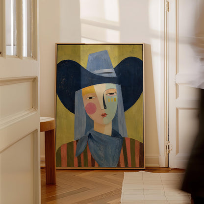 Cubist cowgirl with a big navy hat and multicolor face on olive yellow, canvas wall art styled against a soft white wall