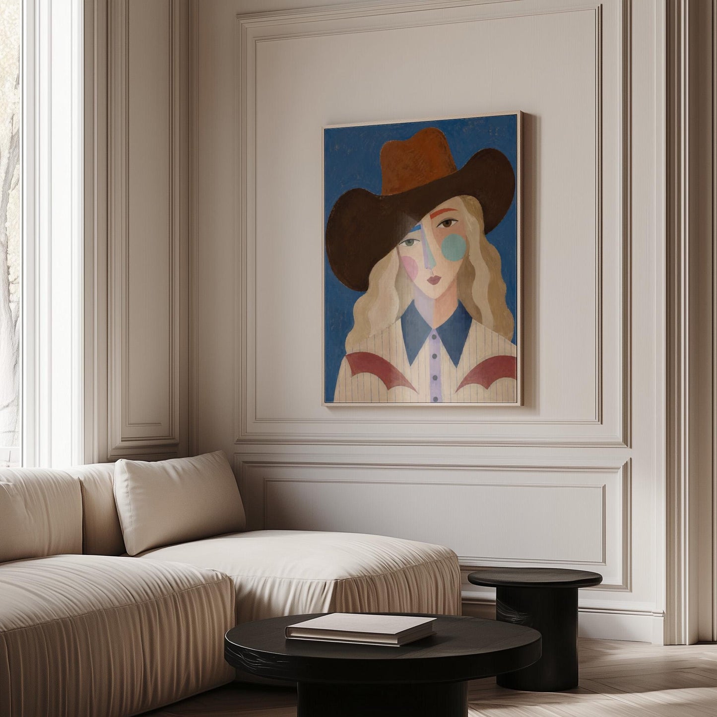 Blonde cowgirl in a rust hat with a cubist pastel face on deep blue, canvas print shown in a sunlit, contemporary room