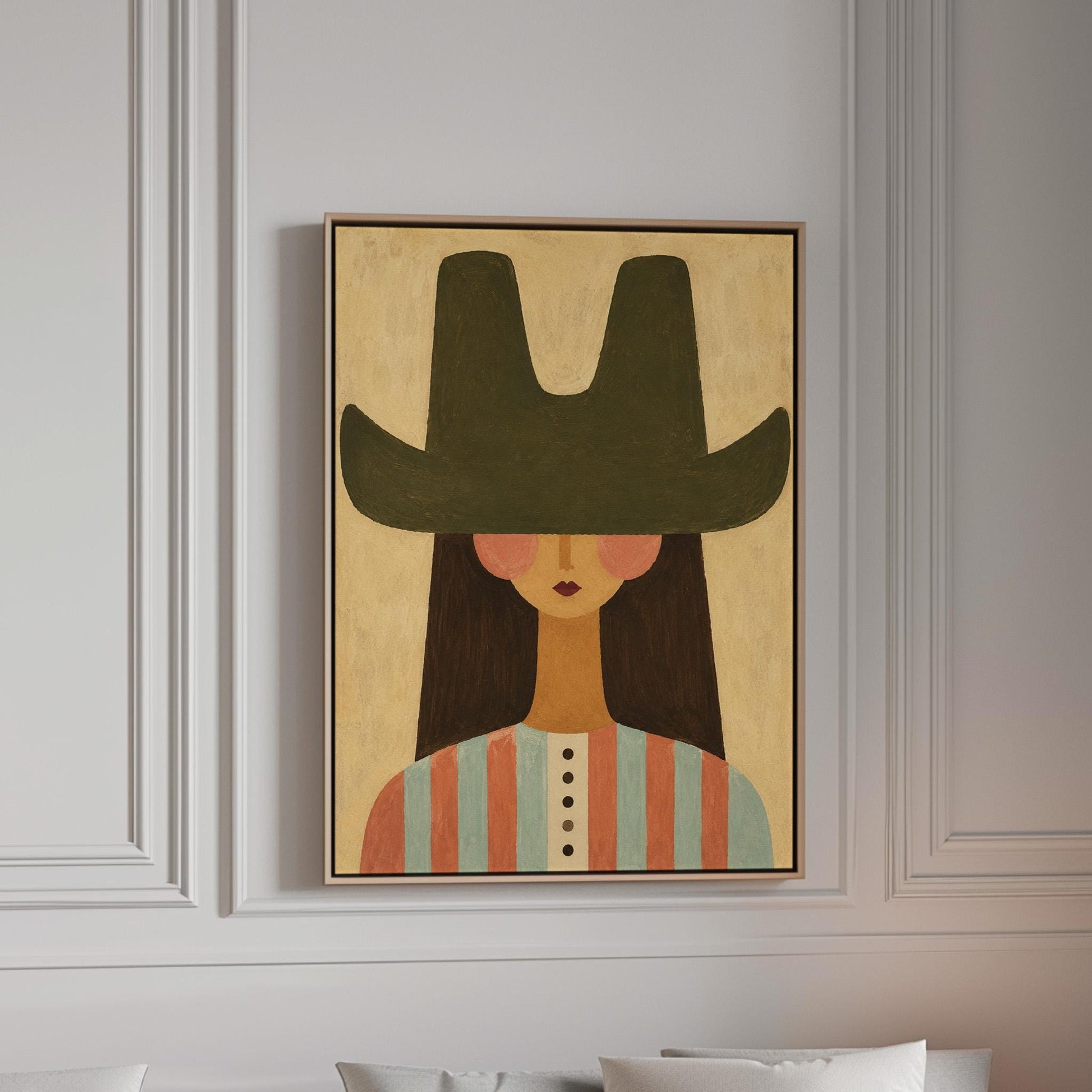 Folk cowgirl in a big green hat and striped shirt with long dark hair, canvas print in a bright room with natural daylight