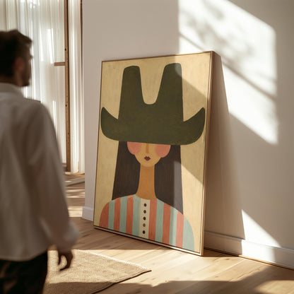 Folk cowgirl in a big green hat and striped shirt with long dark hair, canvas print hanging in a calm, modern living space