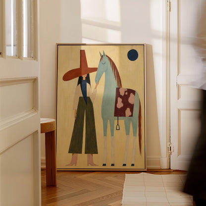 Woman in a wide red hat standing beside a gentle blue horse in the desert, canvas print presented in a light, minimal room