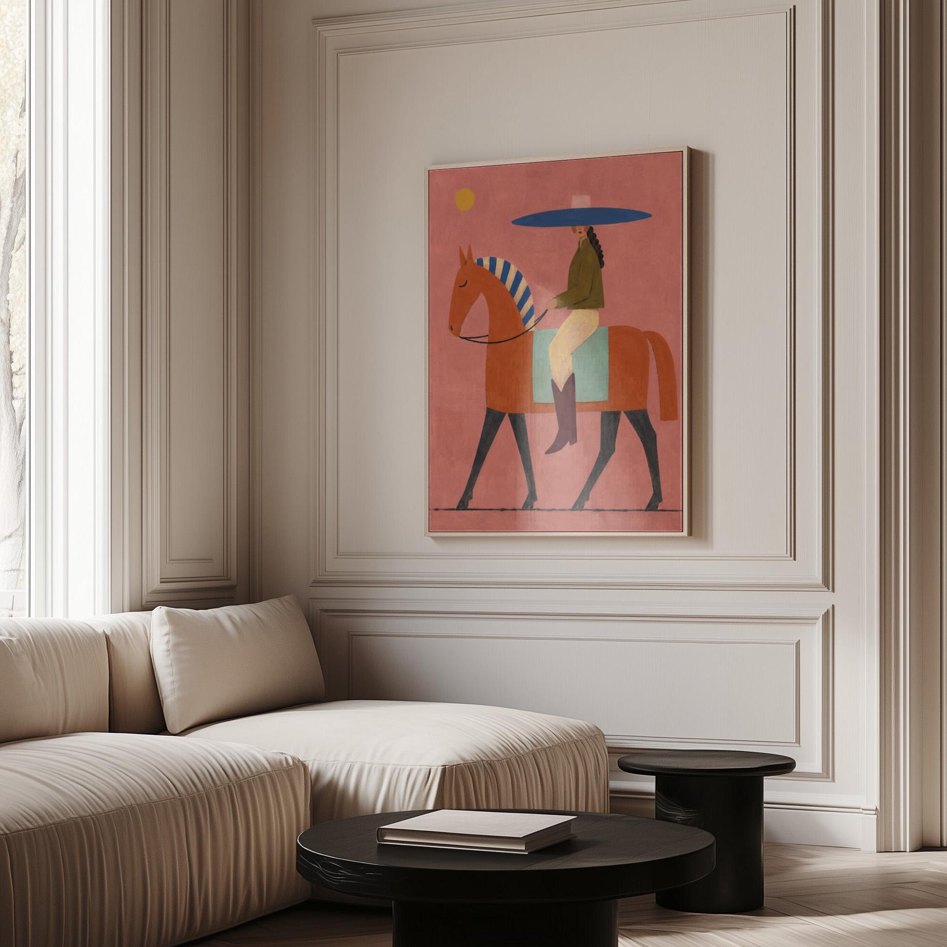 Cowgirl in a broad blue hat riding a rust red horse across a coral sky, canvas print shown in a sunlit, contemporary room