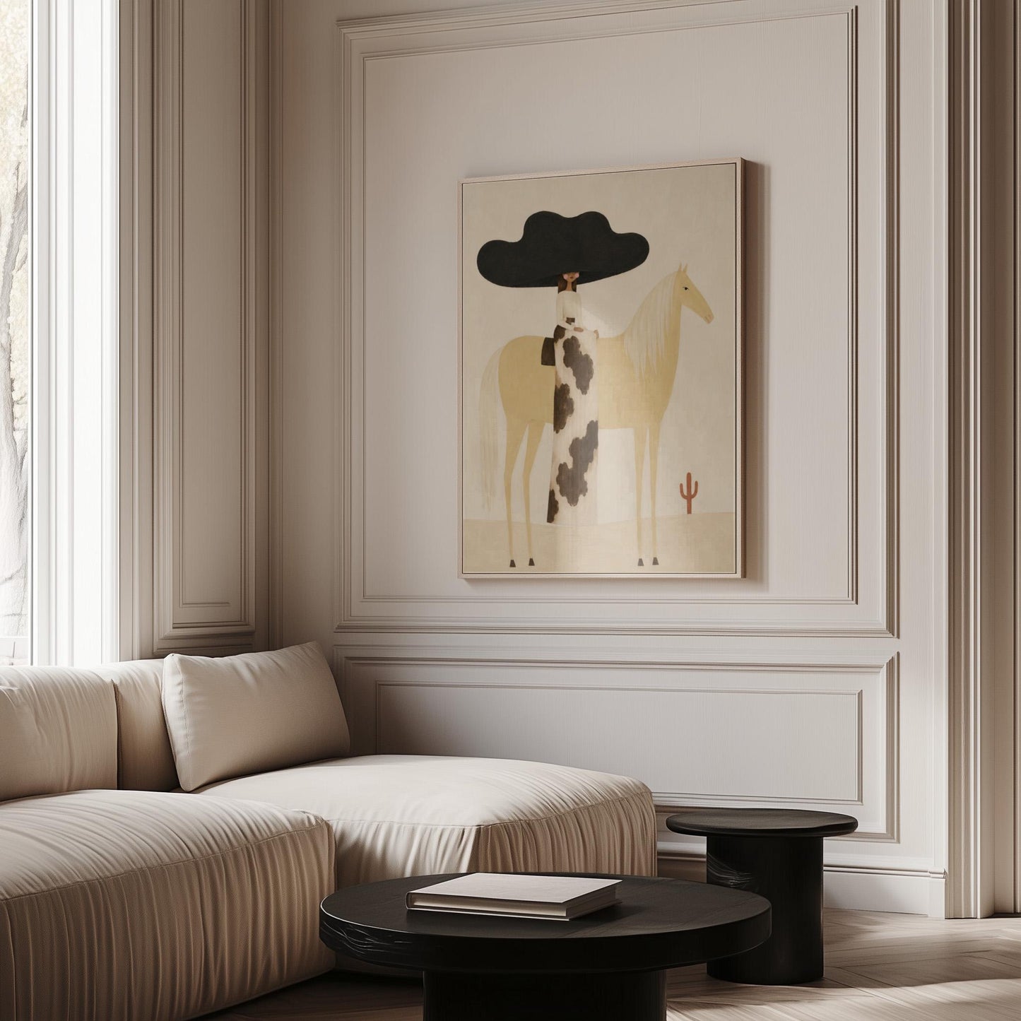 Woman in a huge black hat riding a pale palomino across a desert with cactus, canvas print hanging in a calm, modern living space