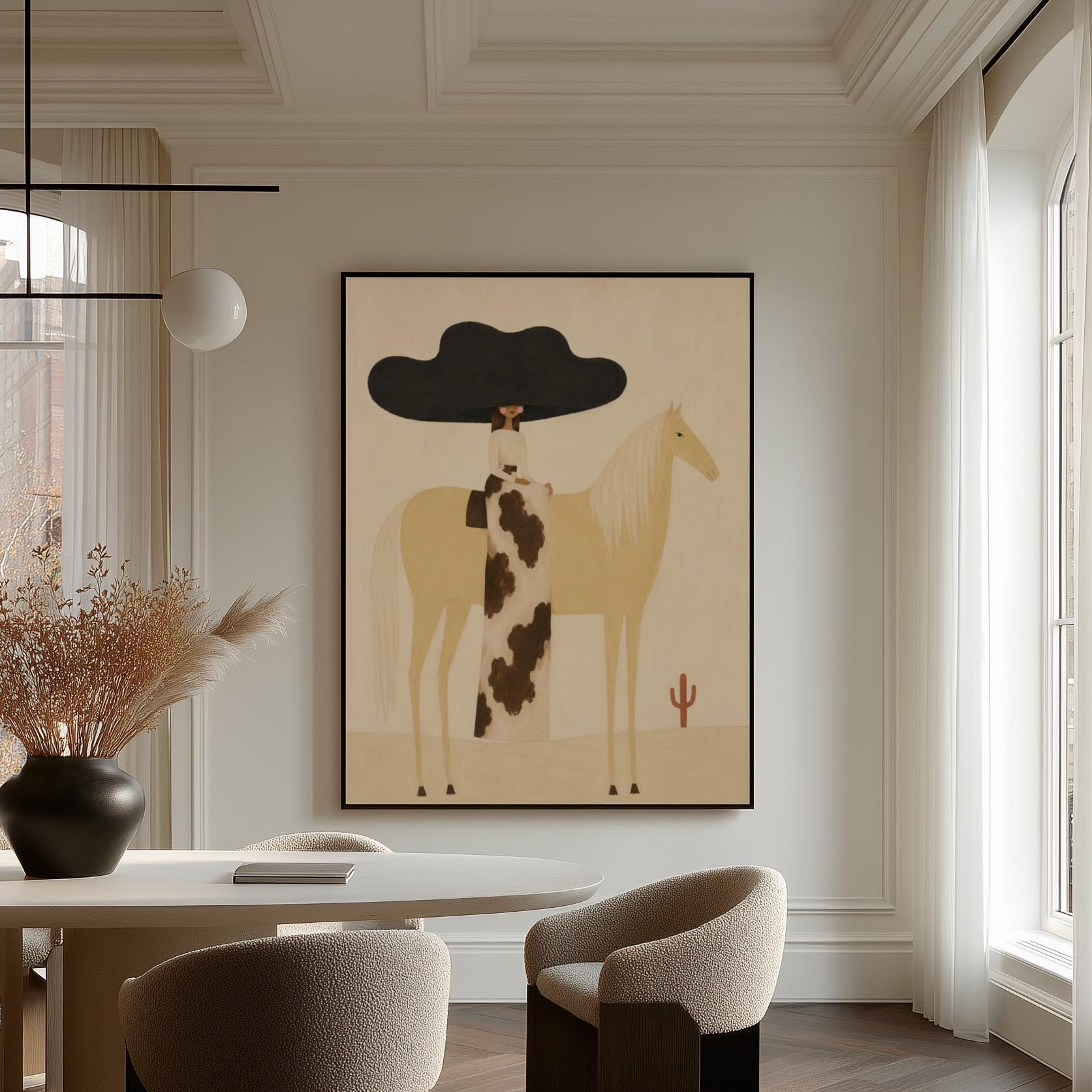 Woman in a huge black hat riding a pale palomino across a desert with cactus, canvas wall art hanging in a calm, modern living space