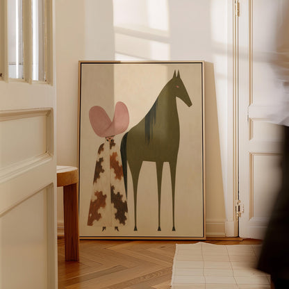 Cowgirl in a green hat and spotted pants before a deep maroon folk horse, canvas wall art on a quiet wall in a considered interior