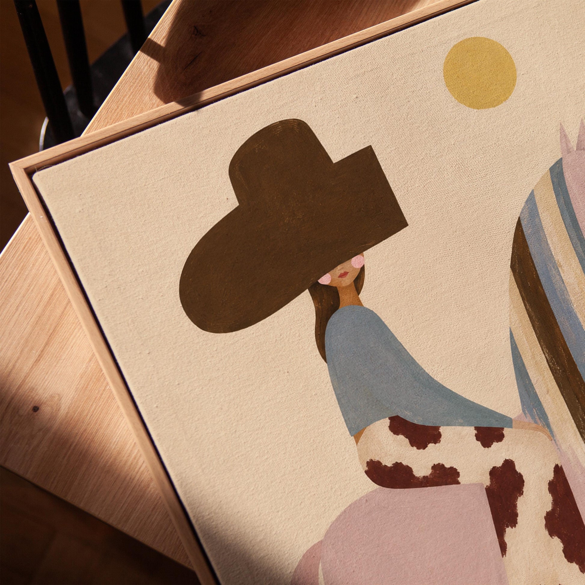 Woman in a large brown hat riding a soft pink horse with a striped mane, canvas print in a warm, minimally styled interior