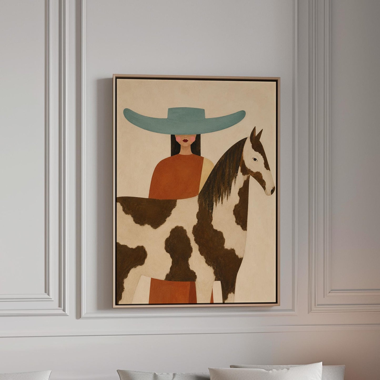 Woman in a teal hat beside a brown and white pinto horse in warm light, canvas print in a bright room with natural daylight