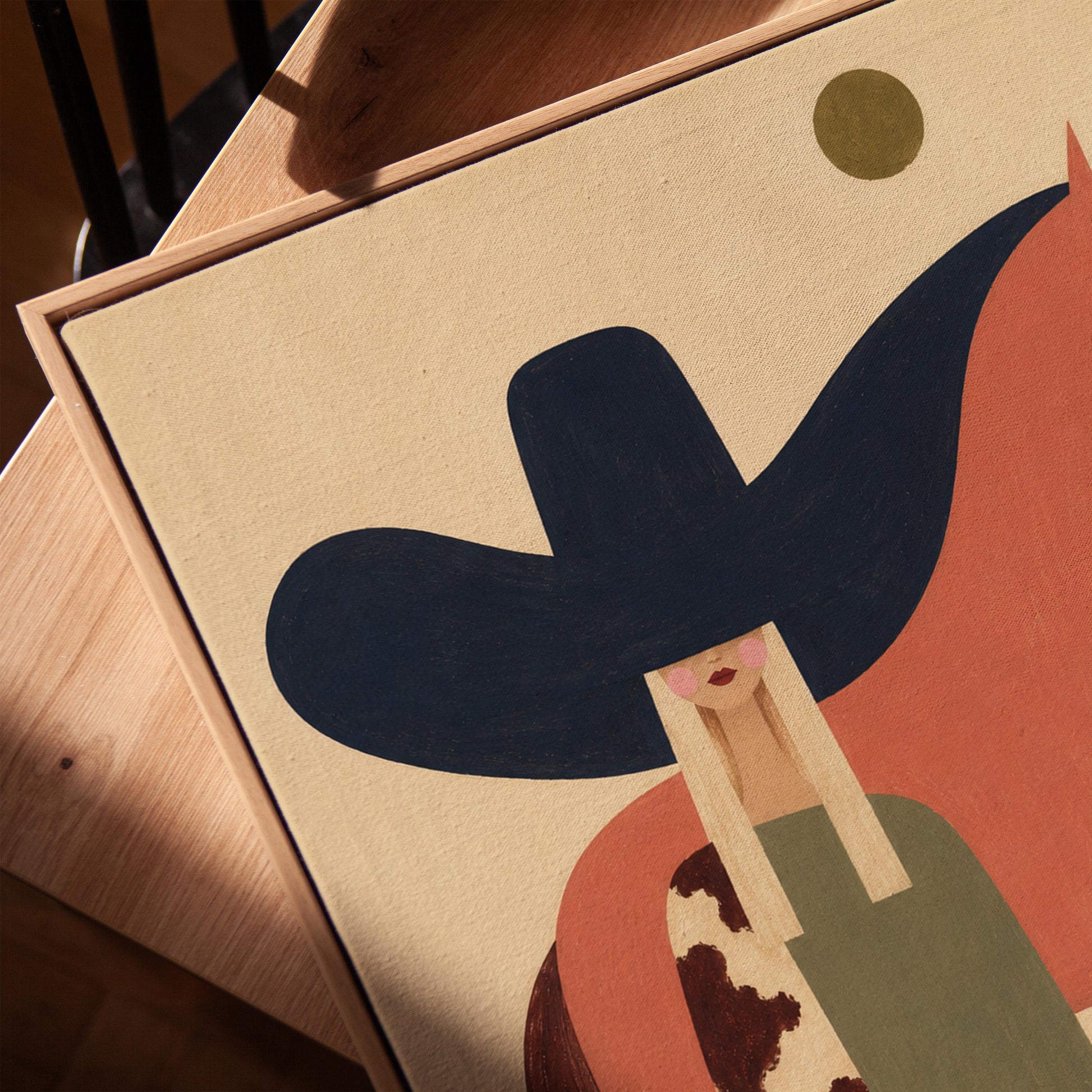 Cowgirl in a black sombrero and cow print cape beside a rust red horse, canvas print in a warm, minimally styled interior