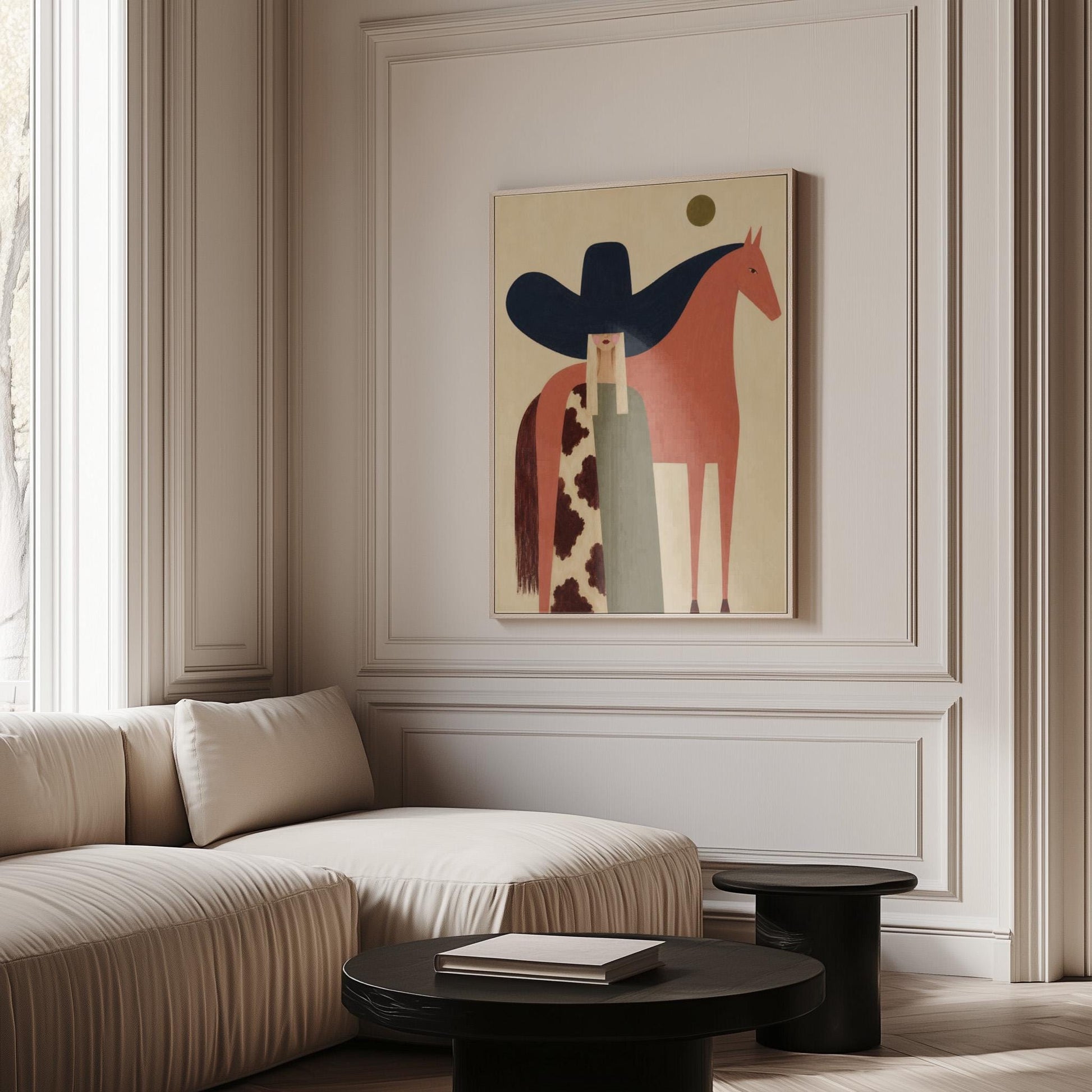 Cowgirl in a black sombrero and cow print cape beside a rust red horse, canvas print shown to scale in a furnished room