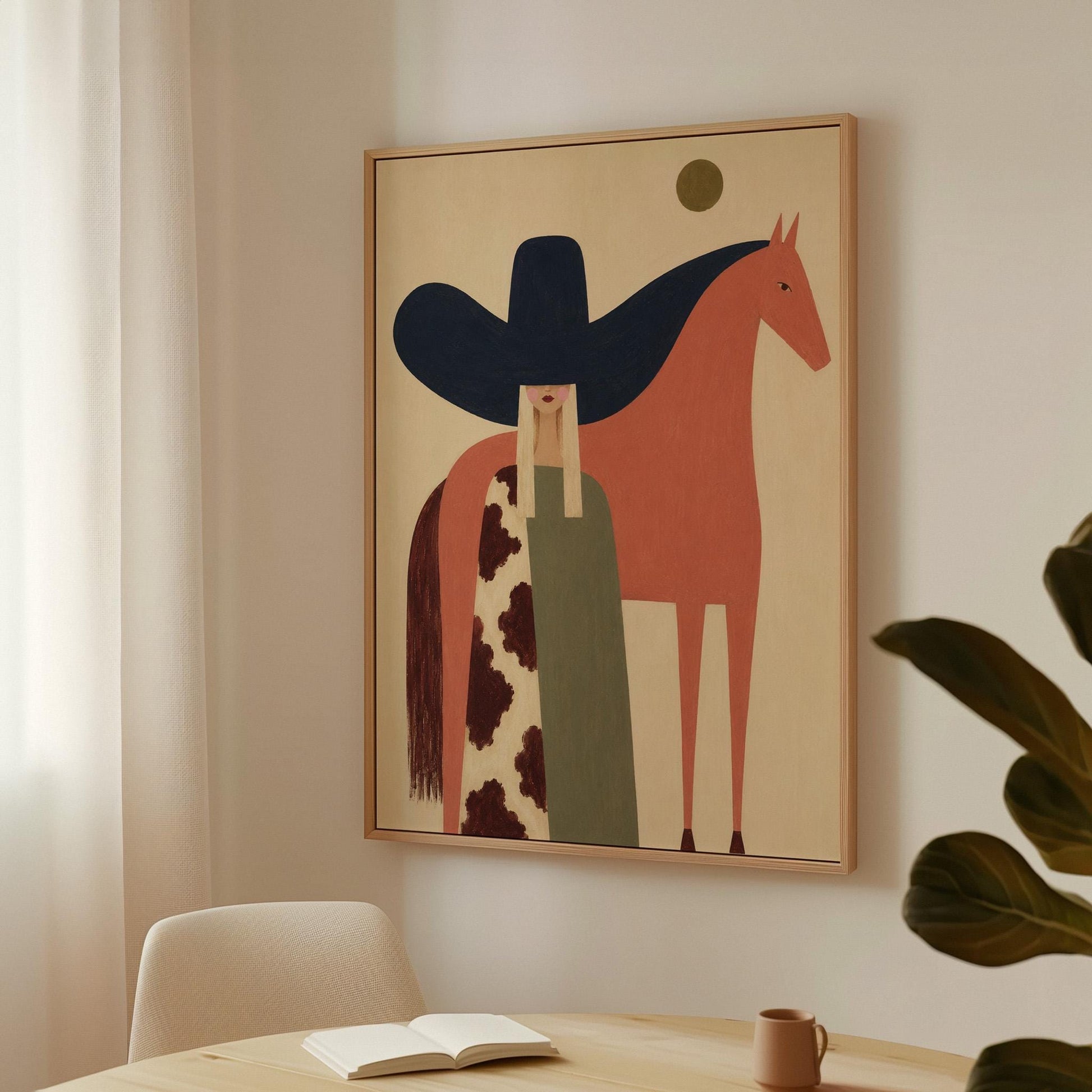 Cowgirl in a black sombrero and cow print cape beside a rust red horse, canvas wall art styled against a soft white wall