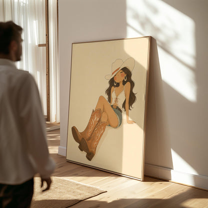 Cowgirl in denim shorts and cowboy boots leaning back under a wide pale hat, canvas wall art presented in a light, minimal room