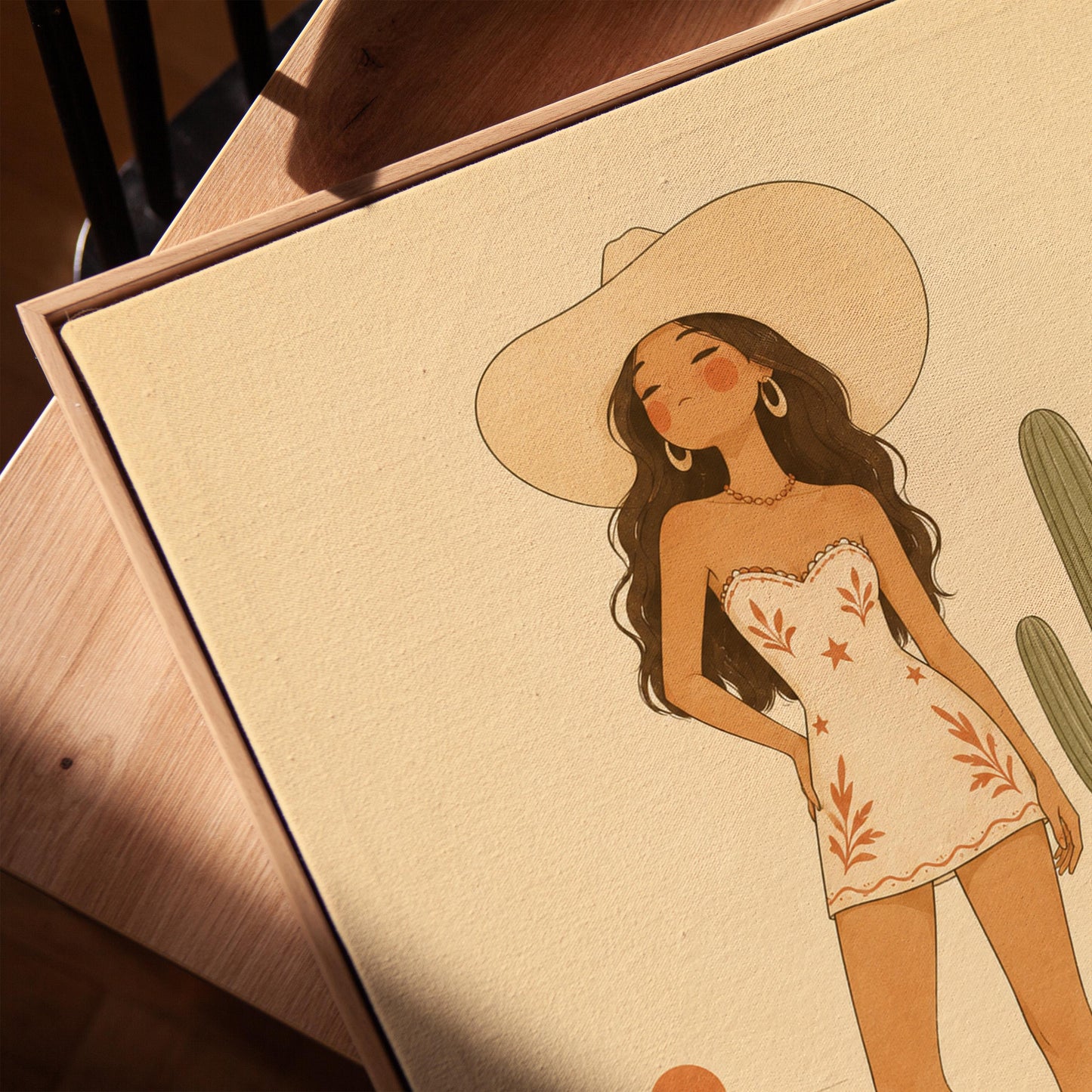 Cowgirl in a white dress and boots beside a saguaro cactus at desert sunset, canvas print in a warm, minimally styled interior
