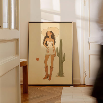 Cowgirl in a white dress and boots beside a saguaro cactus at desert sunset, canvas print on a quiet wall in a considered interior