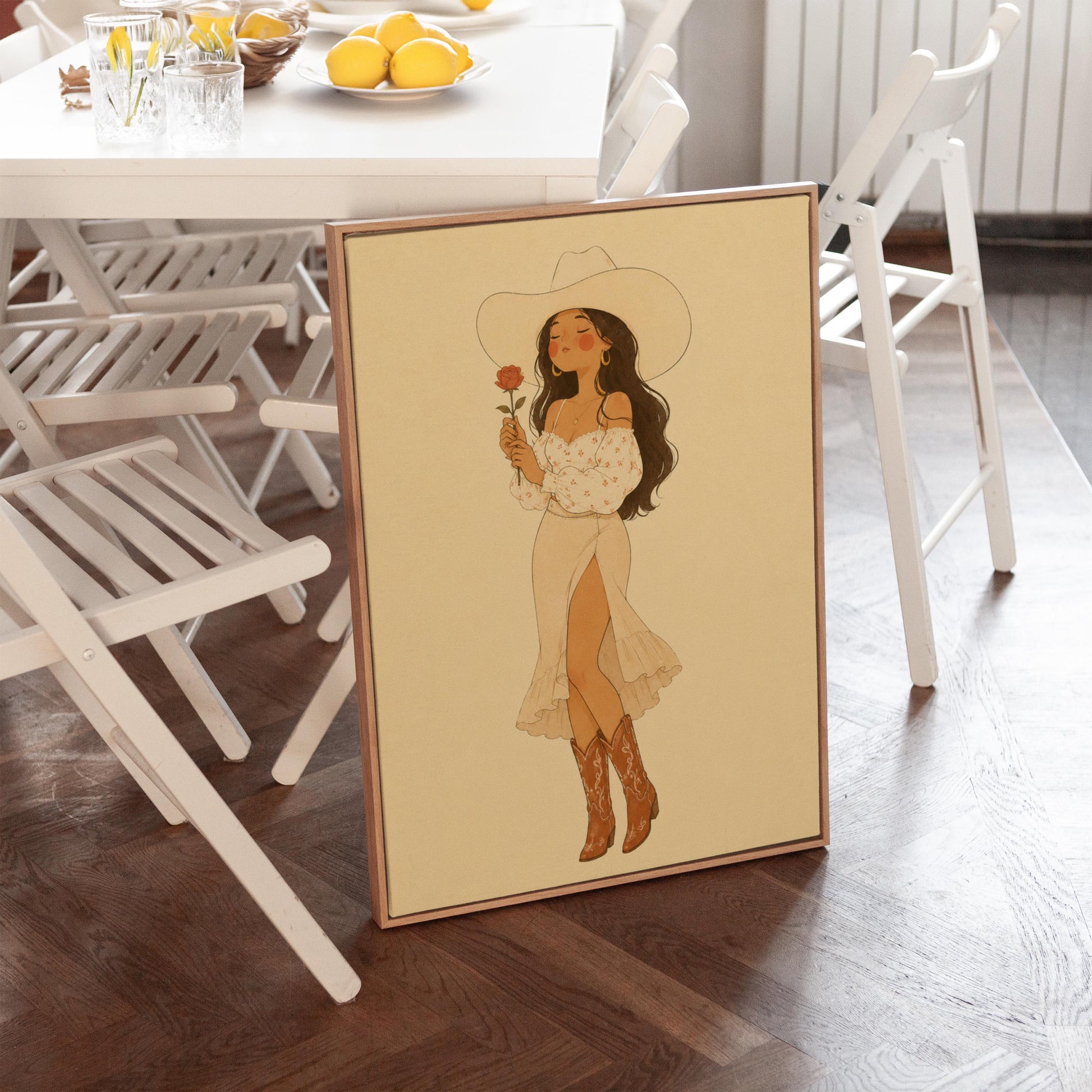 Cowgirl in white dress holding a red rose under a wide hat, canvas wall art presented in a light, minimal room