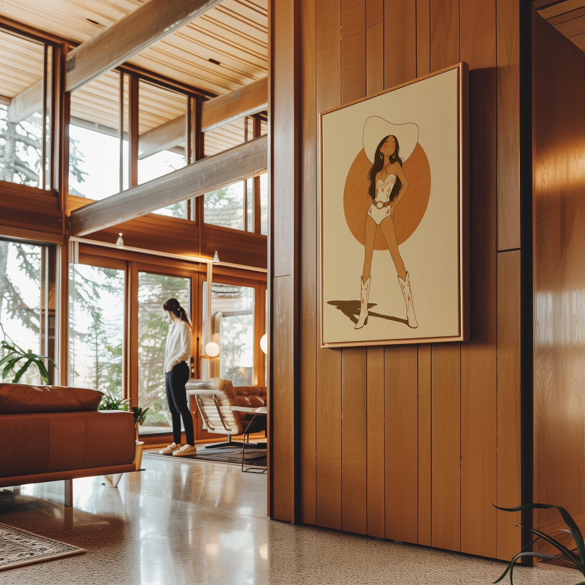 Cowgirl in a white star bodysuit against a large burnt orange sun disc, canvas print seen in a warm interior with natural light