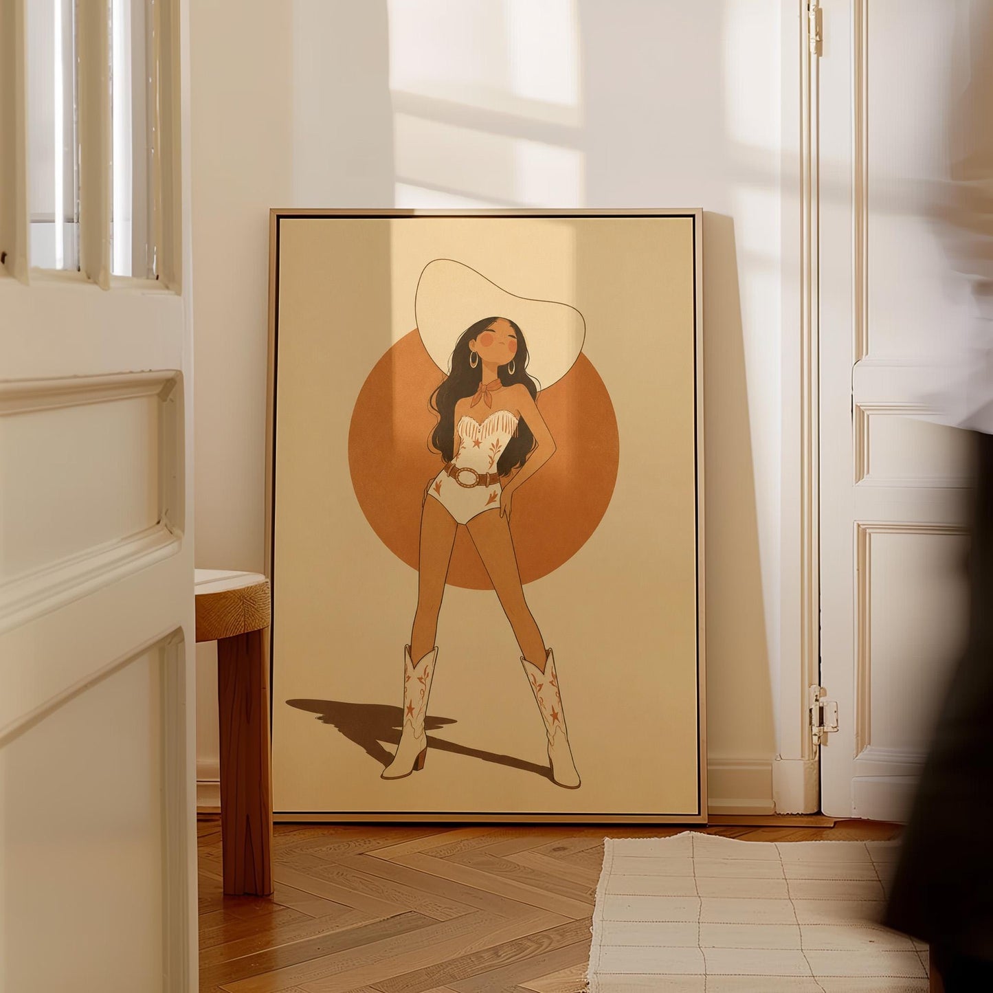 Cowgirl in a white star bodysuit against a large burnt orange sun disc, canvas print on a quiet wall in a considered interior