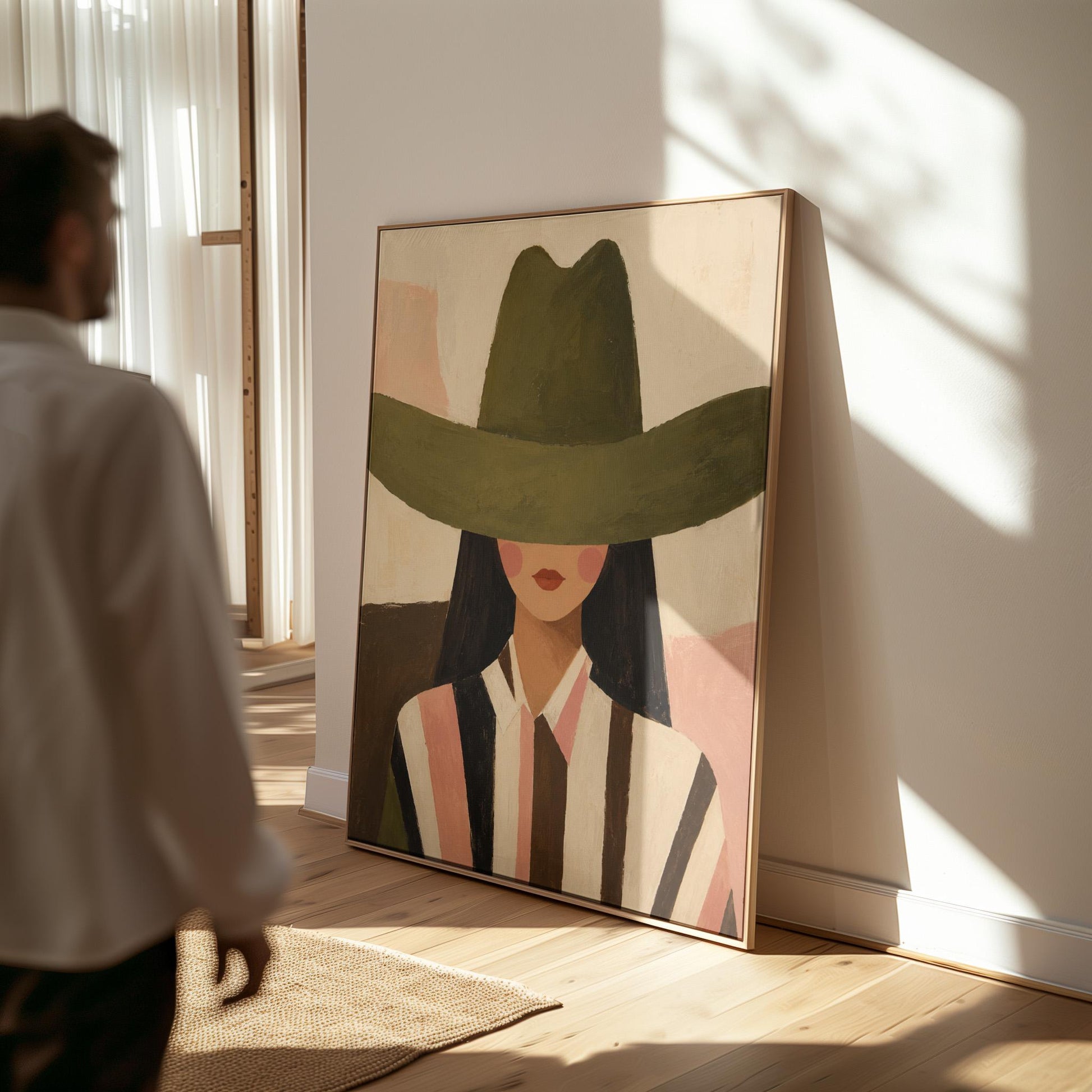 Faceless cowgirl portrait under a broad olive green hat, canvas wall art seen in a warm interior with natural light