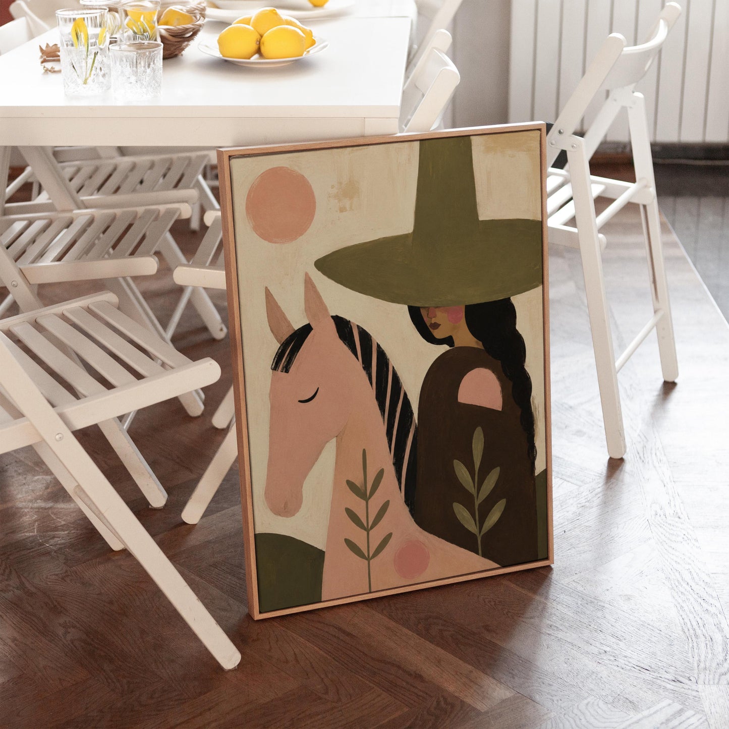 Pink horse beside a cowgirl in an olive hat with leaf motifs, canvas print on a quiet wall in a considered interior