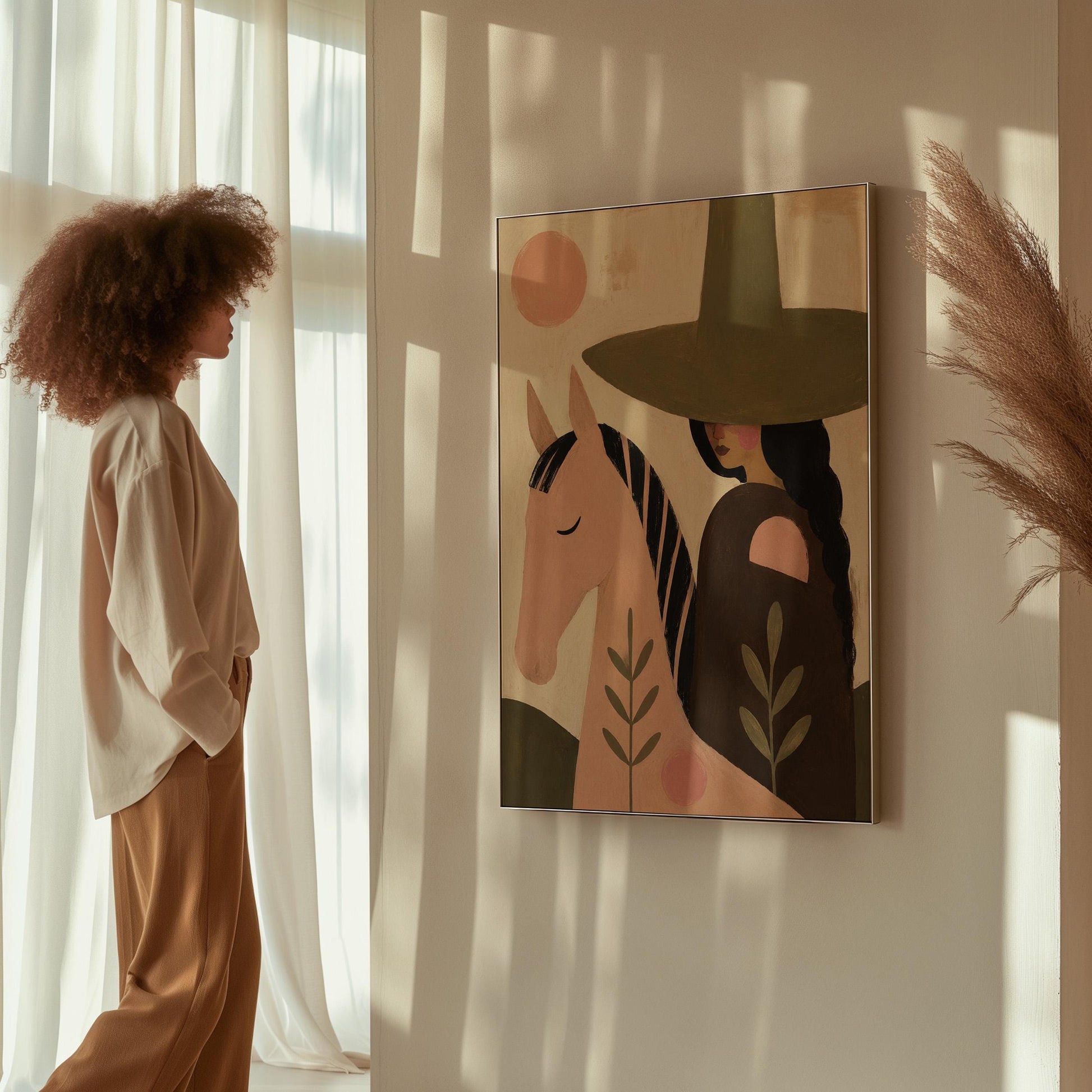 Pink horse beside a cowgirl in an olive hat with leaf motifs, canvas wall art on a quiet wall in a considered interior