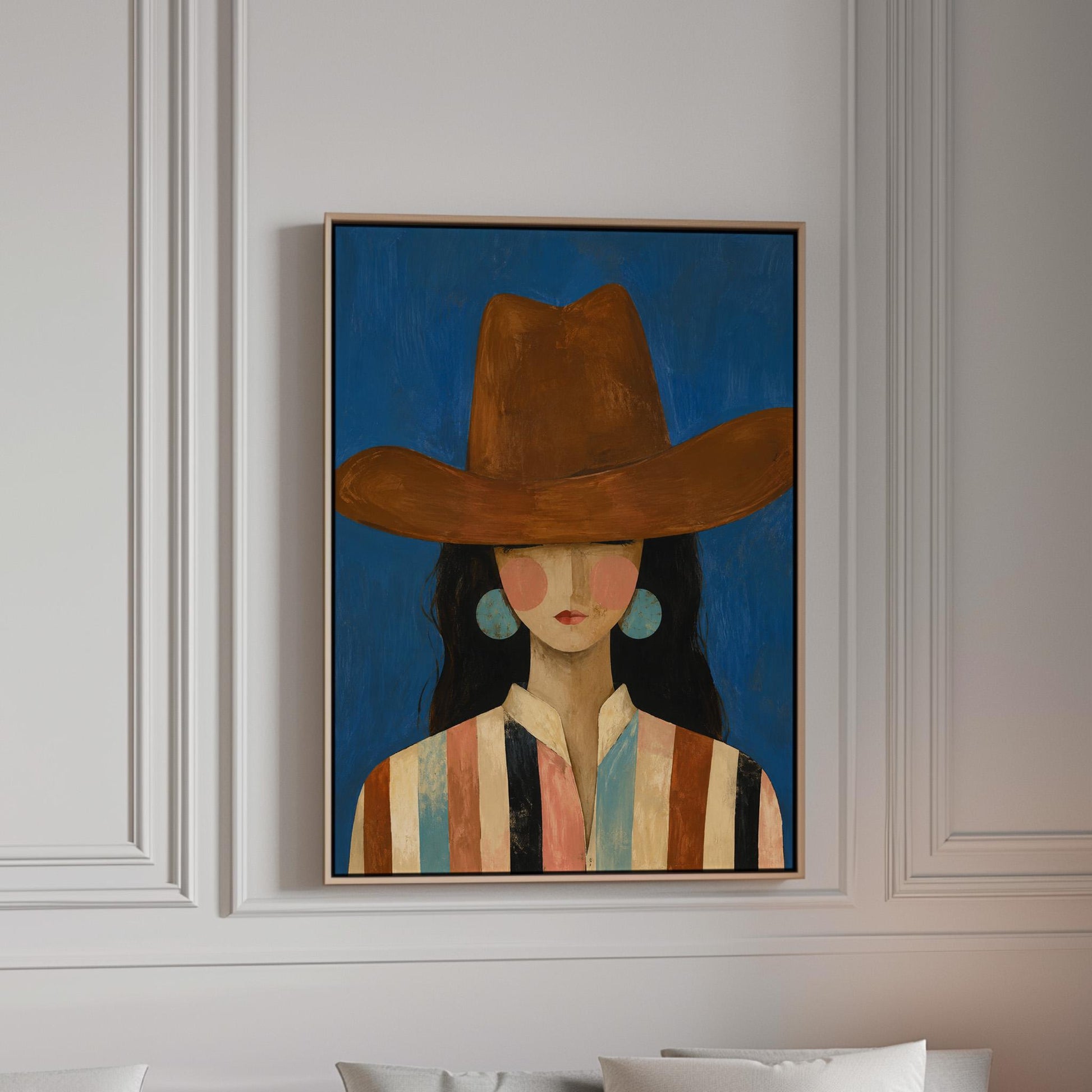 Cowgirl in a brown hat and turquoise earrings on cobalt blue, canvas print in a bright room with natural daylight