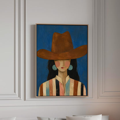 Cowgirl in a brown hat and turquoise earrings on cobalt blue, canvas print in a bright room with natural daylight