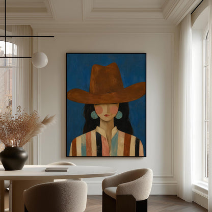 Cowgirl in a brown hat and turquoise earrings on cobalt blue, canvas print hanging in a calm, modern living space