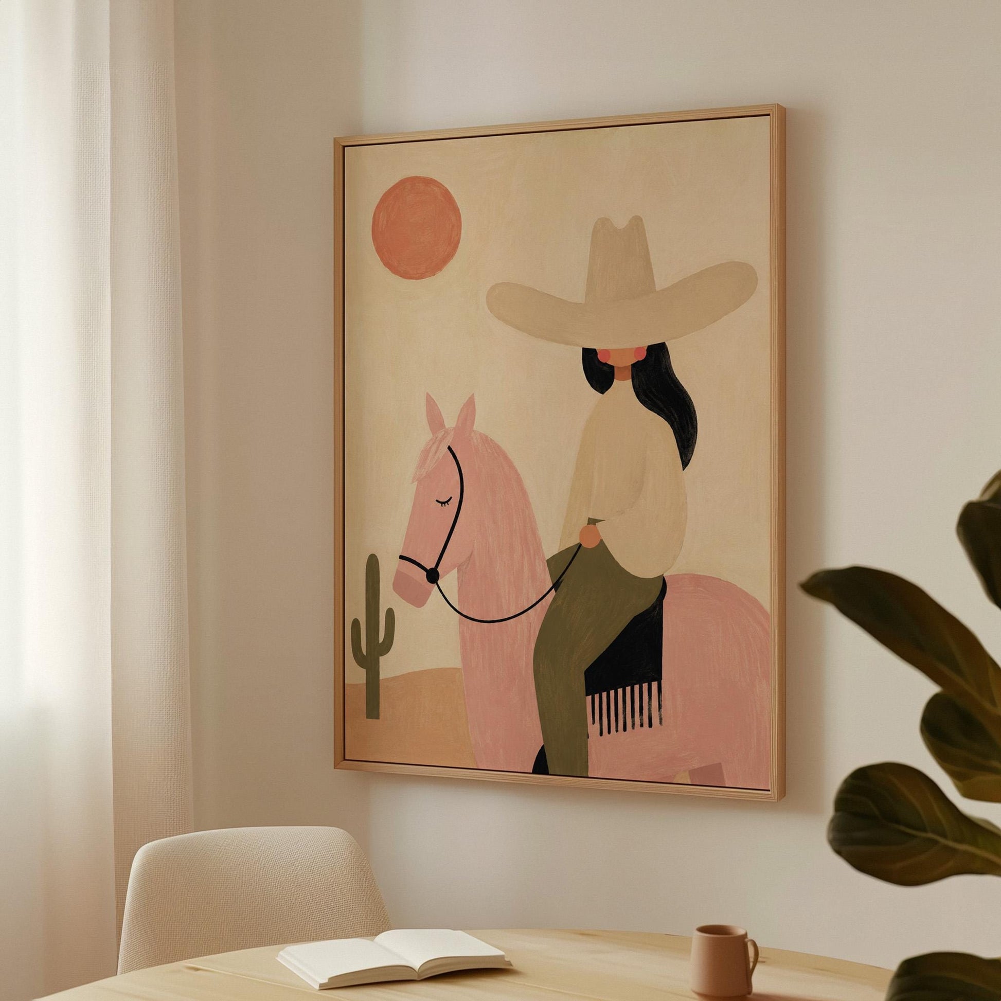 Cowgirl in a pale hat riding a soft pink horse past a desert cactus, canvas print hanging in a calm, modern living space