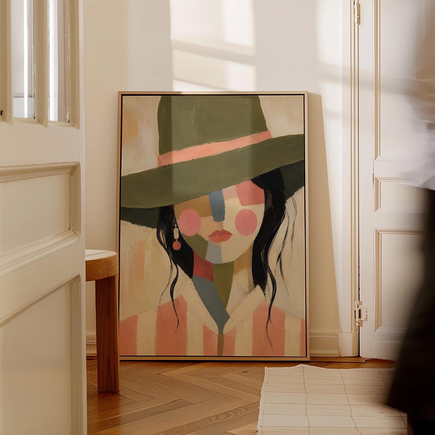 Cowgirl in olive hat with a patchwork face of soft color blocks, canvas wall art presented in a light, minimal room