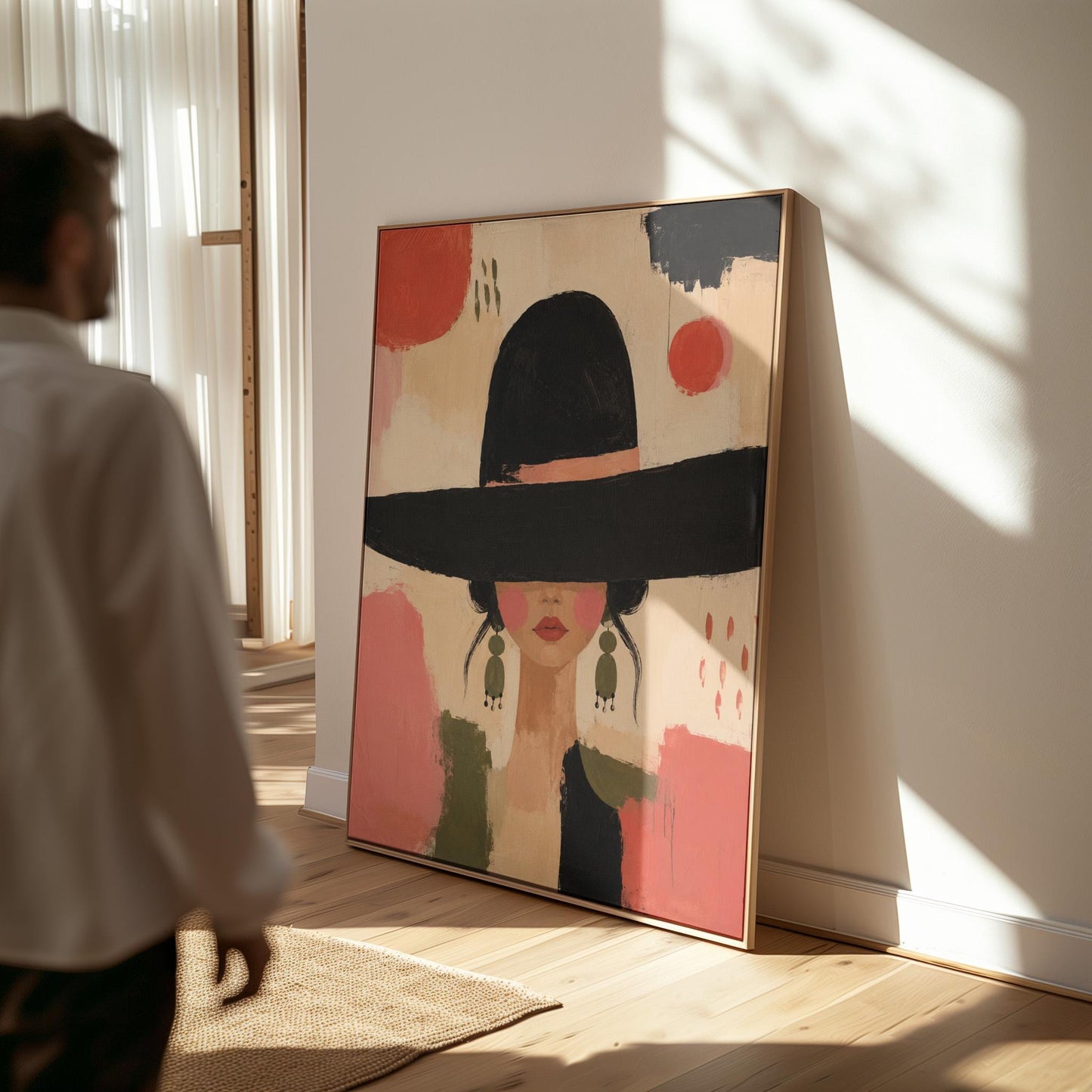 Woman in a wide black hat with olive earrings on red brushwork, canvas wall art seen in a warm interior with natural light