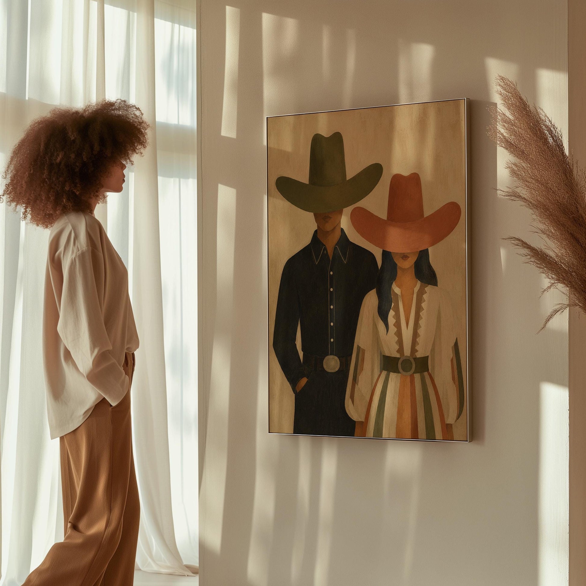 Cowboy and cowgirl standing side by side with hats tipped low, canvas print presented in a light, minimal room