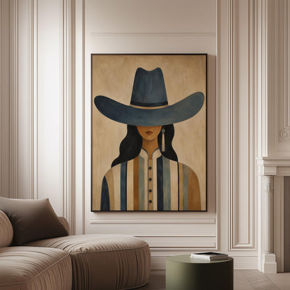 Cowgirl in a slate blue hat and striped shirt on warm sand, canvas print on a softly lit wall in a calm interior