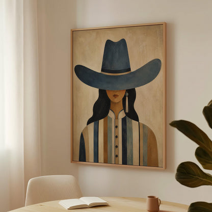 Cowgirl in a slate blue hat and striped shirt on warm sand, canvas print shown to scale in a furnished room