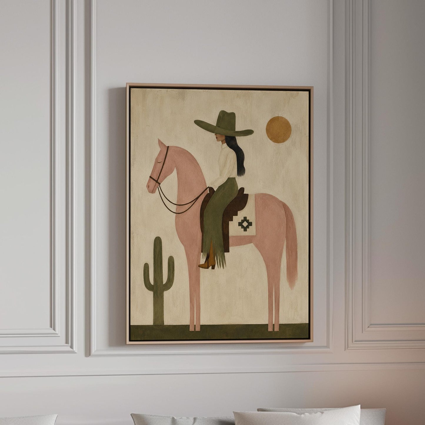 Cowgirl on a dusty pink horse beside a tall saguaro cactus, canvas print in a bright room with natural daylight