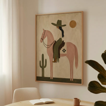 Cowgirl on a dusty pink horse beside a tall saguaro cactus, canvas print on a quiet wall in a considered interior
