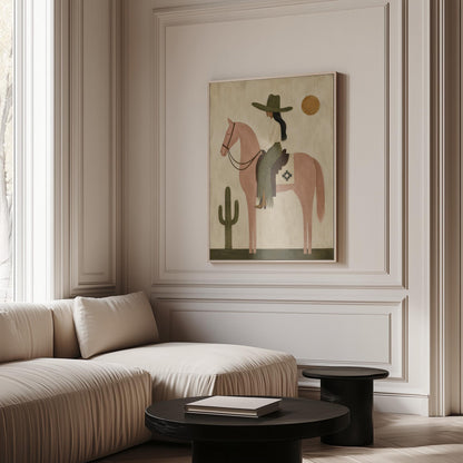 Cowgirl on a dusty pink horse beside a tall saguaro cactus, canvas print shown to scale in a furnished room