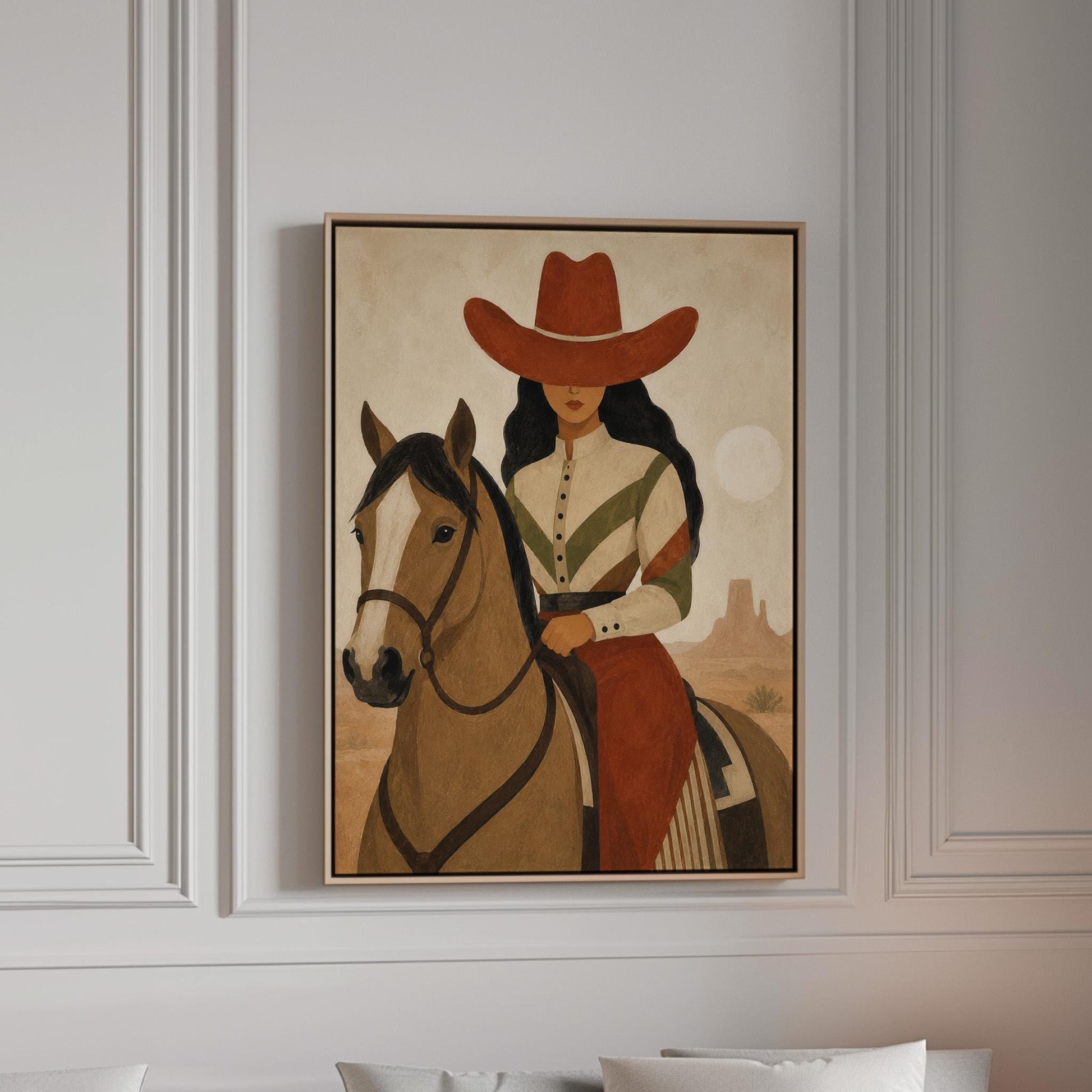 Cowgirl in a red hat riding a bay horse across an ochre desert, canvas print in a bright room with natural daylight