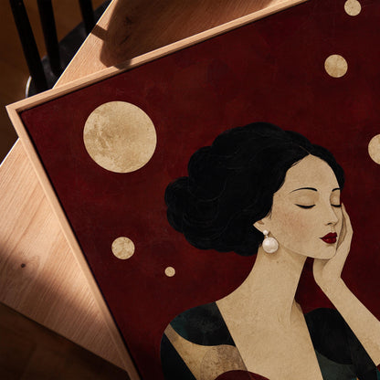 Art deco woman resting her chin on her hand beside a white coffee cup, canvas print in a warm, minimally styled interior