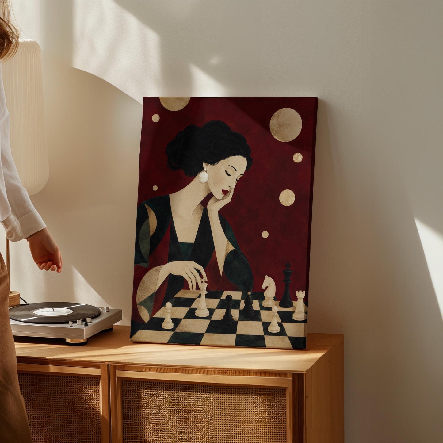 Elegant woman moving a chess piece across a black and white board, canvas print hanging in a calm, modern living space