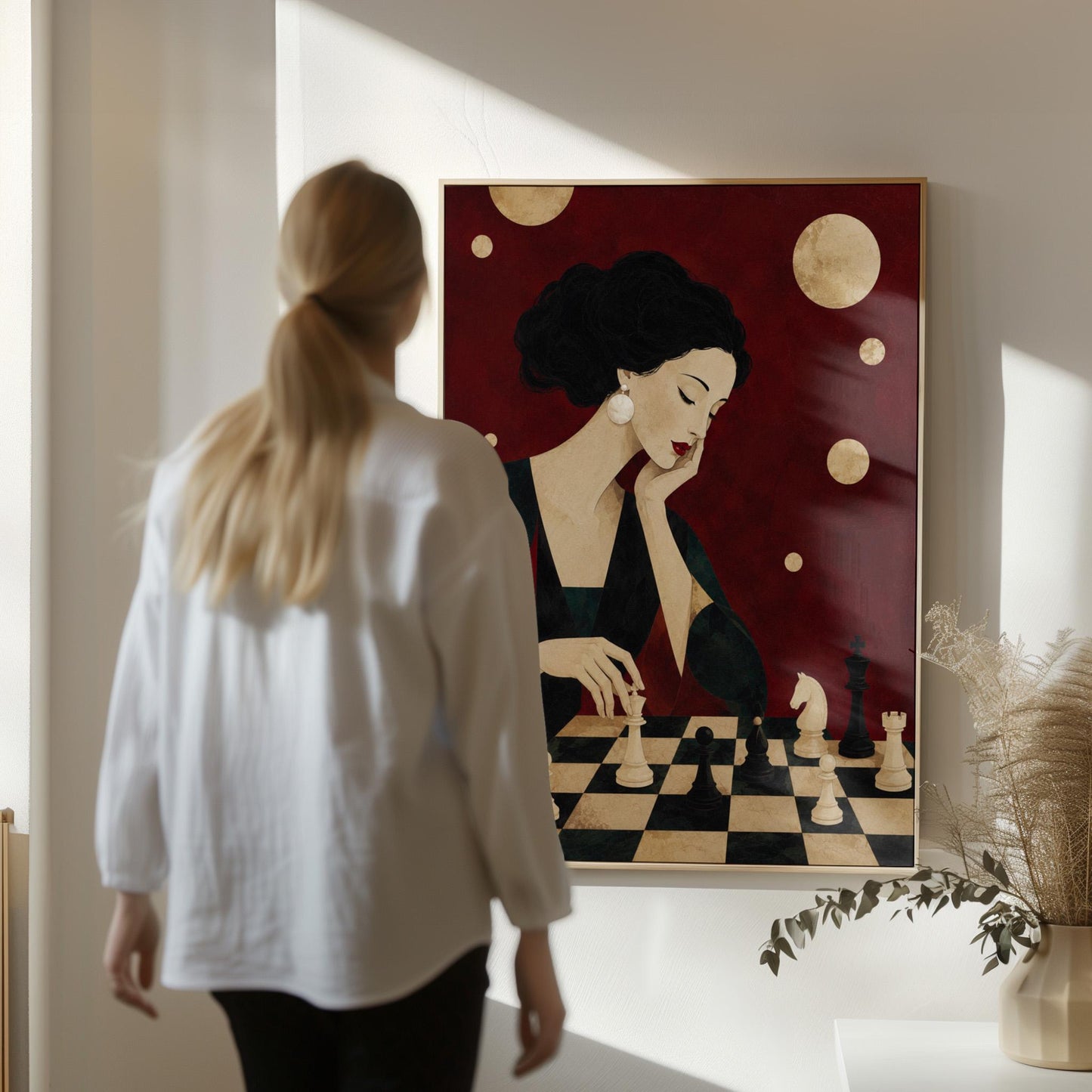 Elegant woman moving a chess piece across a black and white board, canvas wall art on a quiet wall in a considered interior