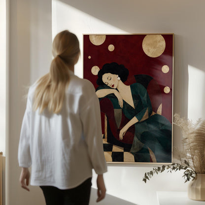 Dark haired woman asleep draped over the back of a deep red armchair, canvas print seen in a warm interior with natural light