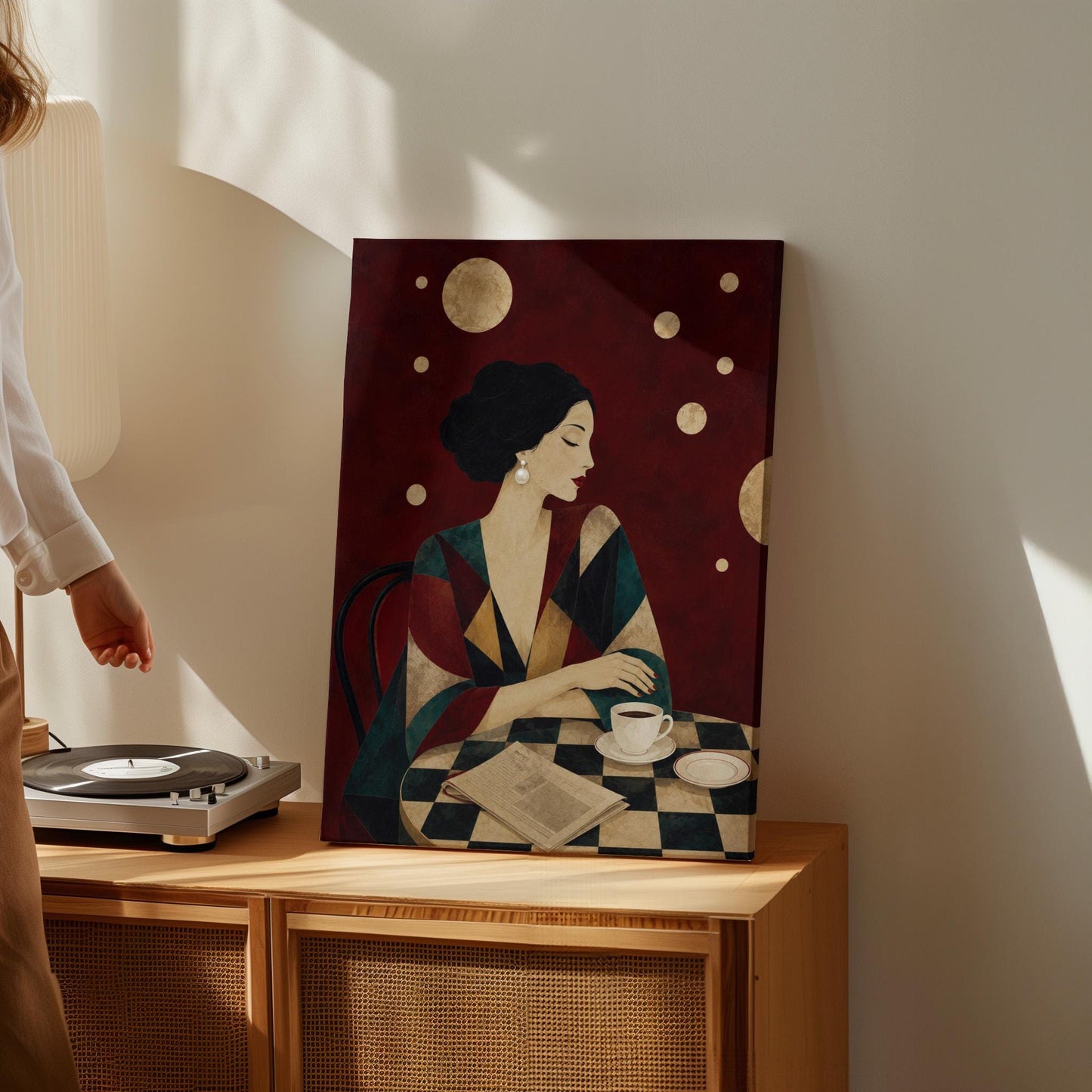 Woman at a cafe table with coffee cup and folded newspaper, canvas print styled against a soft white wall