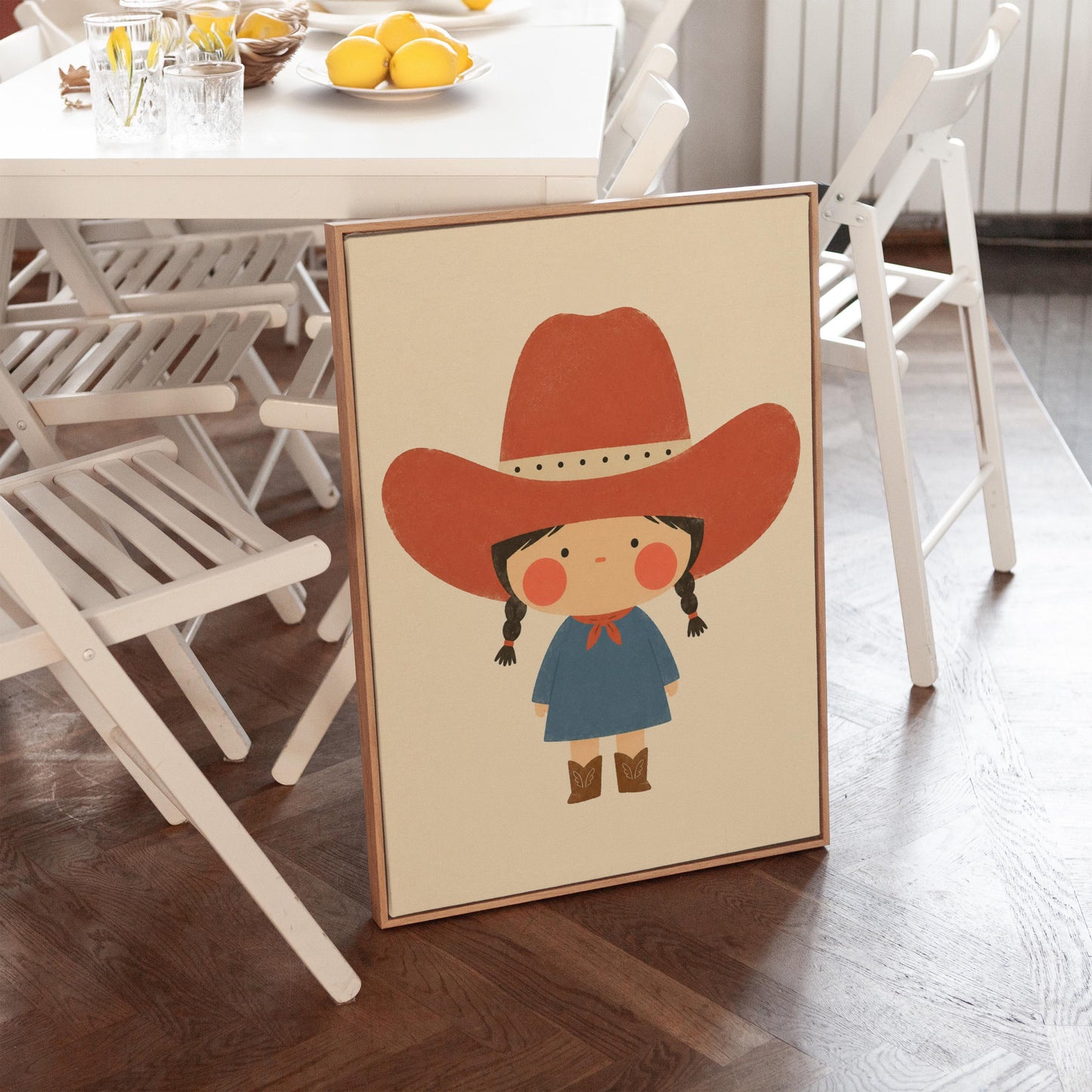 Little cowgirl with braids and rosy cheeks under an oversized red hat, canvas print shown in a sunlit, contemporary room