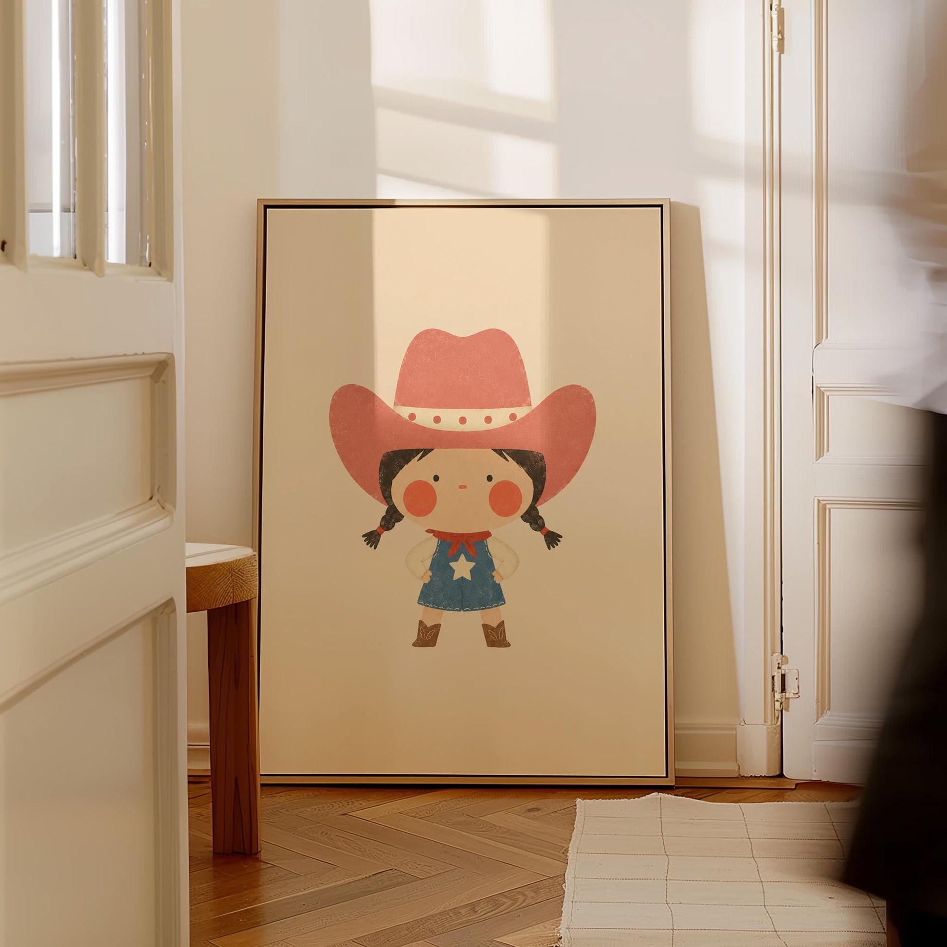 Small cowgirl in a star dress and coral hat with hands on hips, canvas print styled against a soft white wall