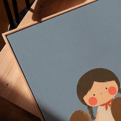 Little cowgirl sitting with big brown boots and a red hat, canvas print in a warm, minimally styled interior