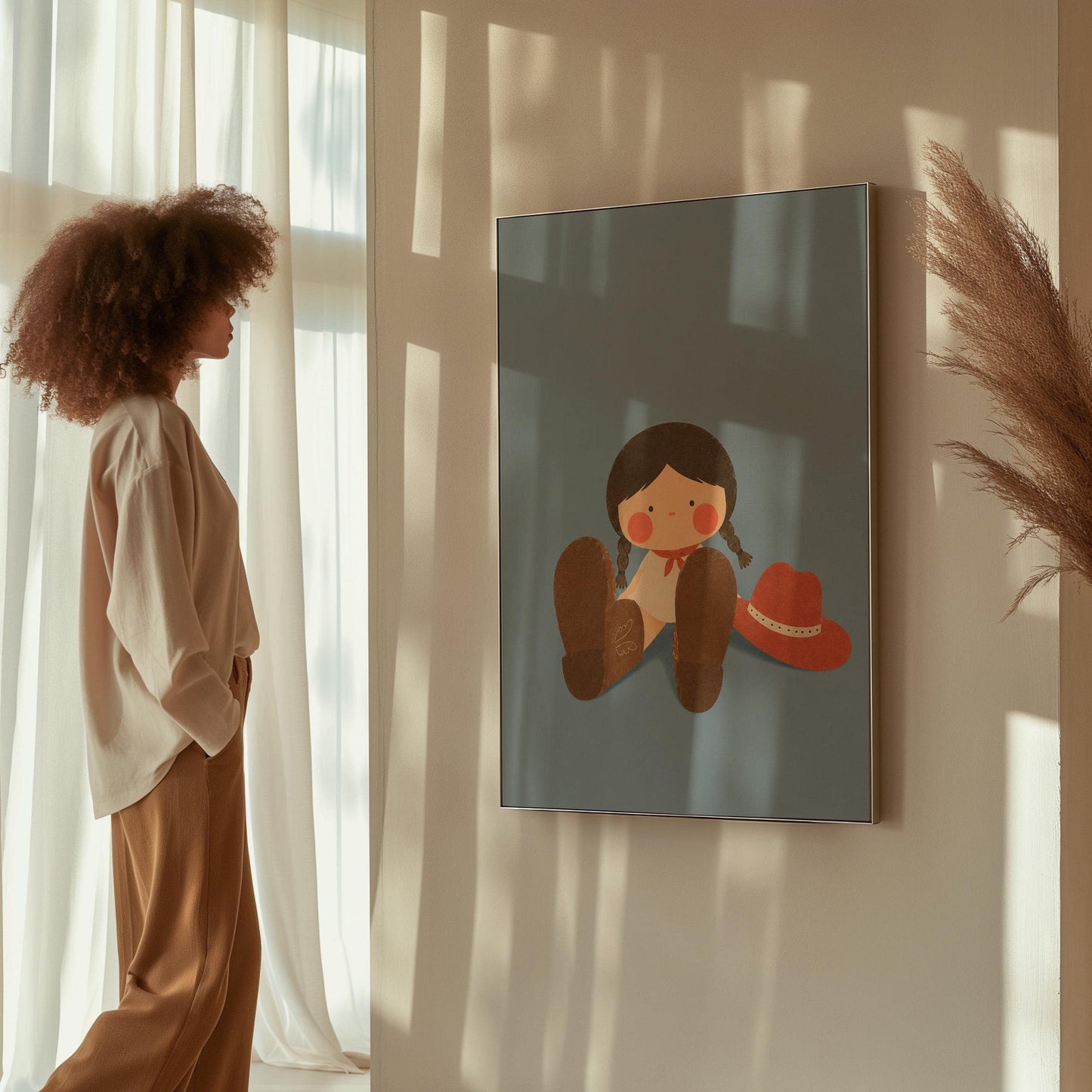Little cowgirl sitting with big brown boots and a red hat, canvas print shown in a sunlit, contemporary room