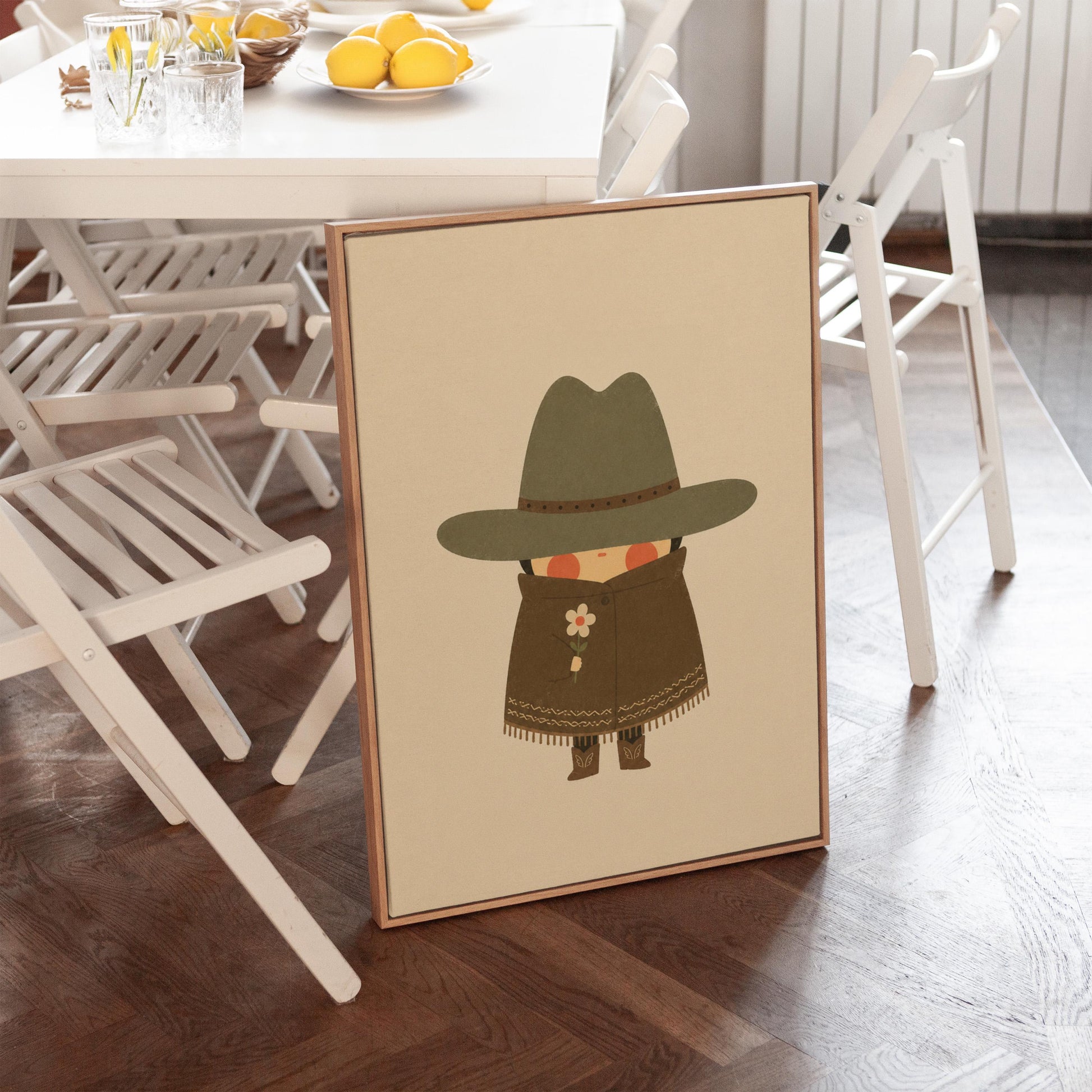 Tiny cowboy in a wide hat and fringed coat holding a daisy, canvas print presented in a light, minimal room
