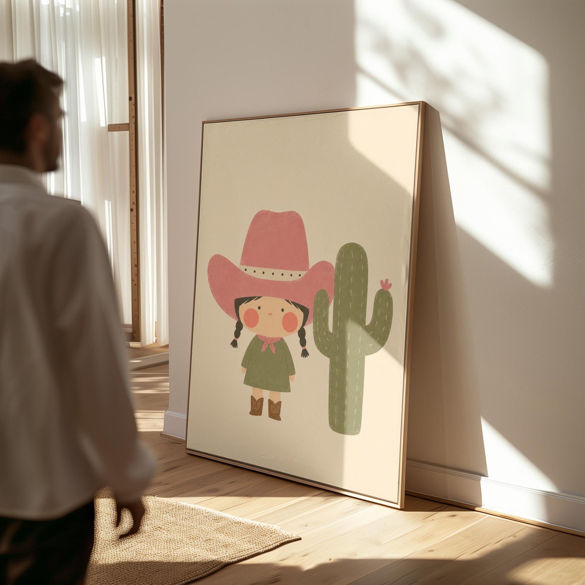 Little cowgirl in a pink hat next to a tall flowering cactus, canvas print hanging in a calm, modern living space