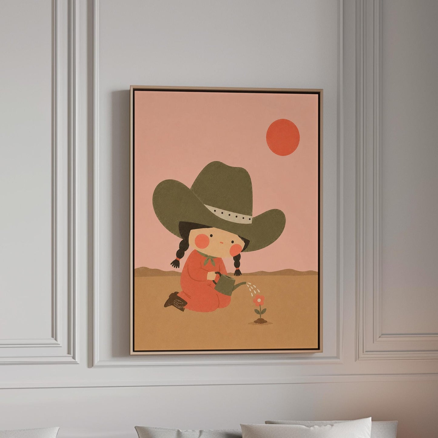 Cowgirl in a green hat watering a small flower in the desert, canvas print in a bright room with natural daylight